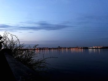 Scenic view of lake against sky at dusk