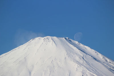 Scenic view of snow covered mountains