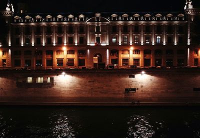 Reflection of illuminated built structure in water