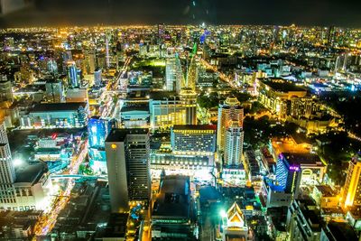 High angle view of illuminated buildings in city at night