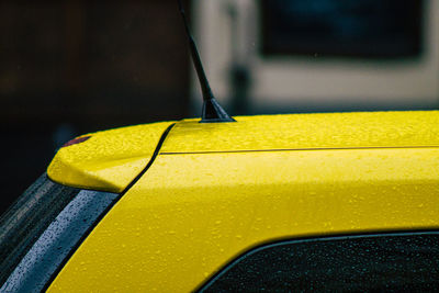 Close-up of yellow car on table