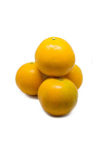 Close-up of oranges against white background