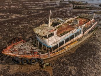 High angle view of abandoned truck on field