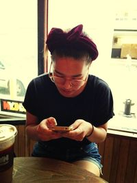 Young woman sitting on floor