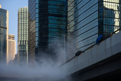 Low angle view of modern buildings in city