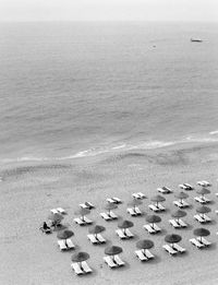 High angle view of stones on beach against sky