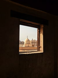 Historical mosque seen through window