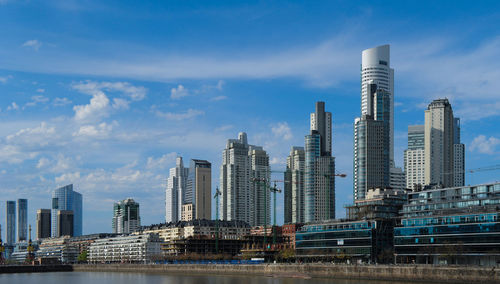 Modern buildings in city against sky