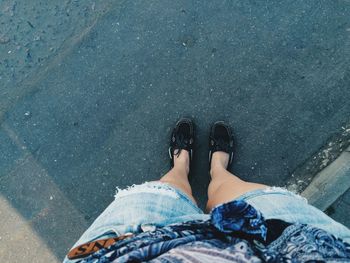 Low section of people standing on tiled floor