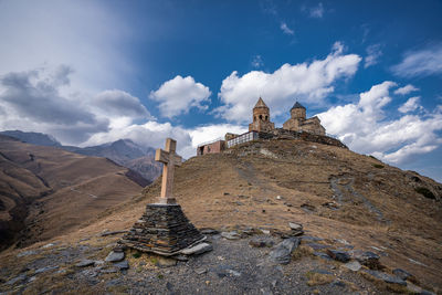 Panoramic view of old building against sky, gergeti