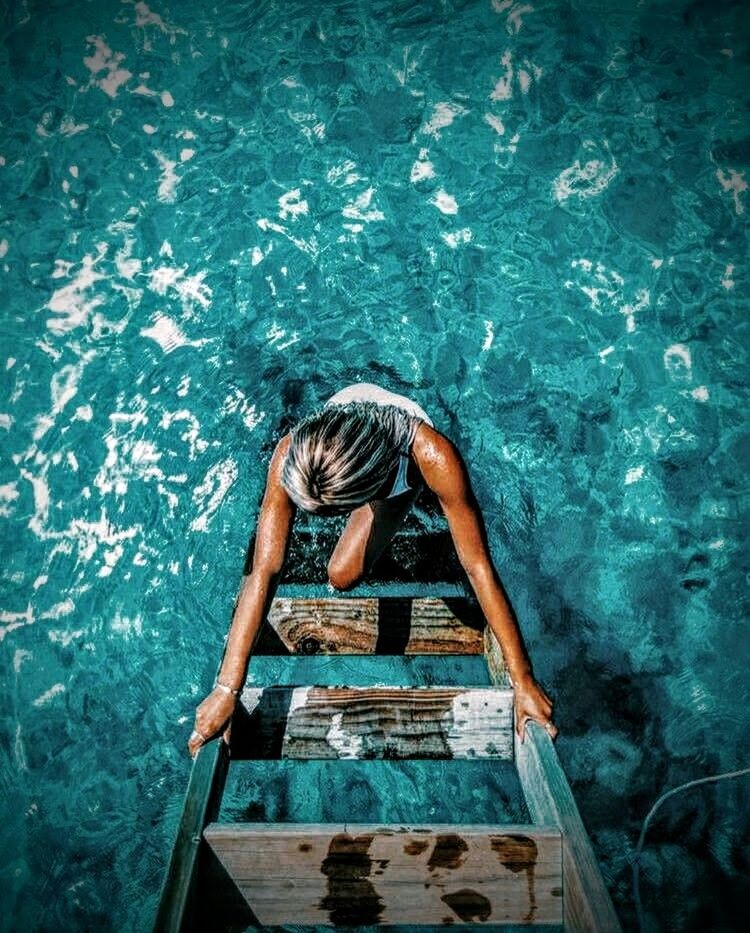 MAN SWIMMING IN POOL