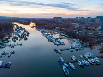 High angle view of buildings by sea against sky