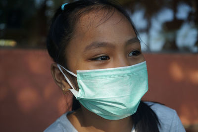 Asian woman wearing a mask