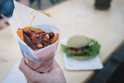 Midsection of person holding ice cream