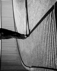 Low section of person standing on wall