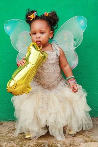 Portrait of cute girl wearing fairy costume