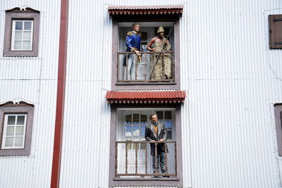 People standing at entrance of building