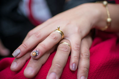 Close-up of couple holding hands