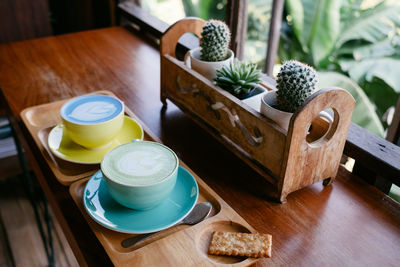 High angle view of coffee served on table