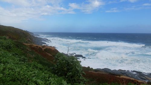 Scenic view of beach against sky