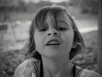 Close-up portrait of smiling young woman