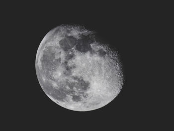 Low angle view of moon against dark sky