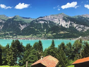 Scenic view of mountains and buildings against sky