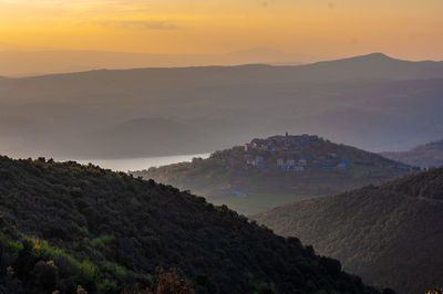 Scenic view of mountains against sky during sunset