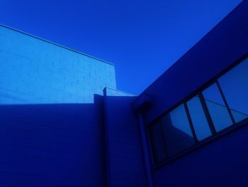 Low angle view of building against blue sky
