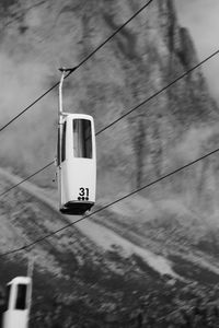 Overhead cable car against sky