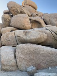 Stack of rocks on beach against sky