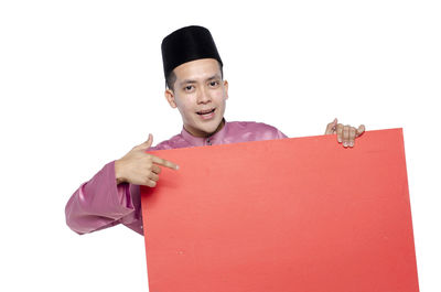 Portrait of young man against white background