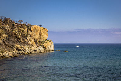 Scenic view of sea against blue sky