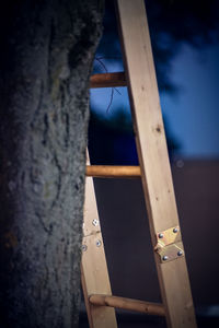 Low angle view of ladder against wall