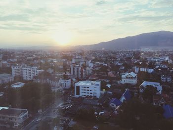 Aerial view of cityscape against sky