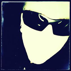 Close-up portrait of silhouette man against clear sky