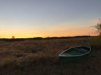 Scenic view of field against sky during sunset