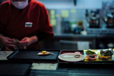 Man preparing food on table at home