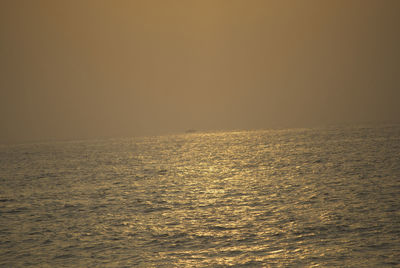 Scenic view of sea against clear sky during sunset