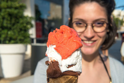 Portrait of man holding ice cream