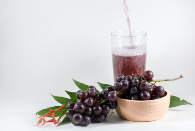 Close-up of drink against white background