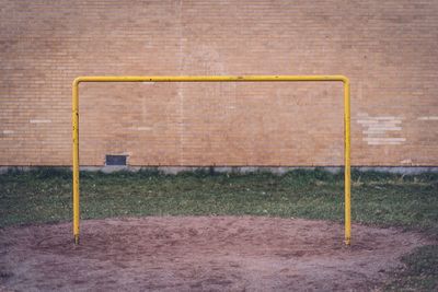 Soccer goal post against wall on field