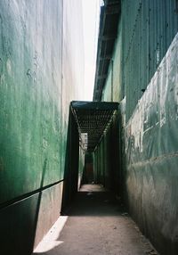 Empty alley amidst buildings