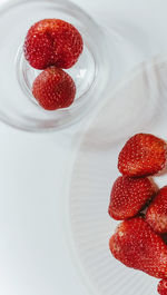 High angle view of strawberries in plate on table