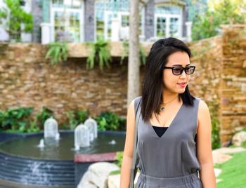 Portrait of young woman wearing sunglasses