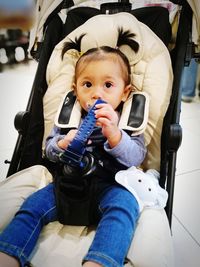 Boy sitting in kitchen