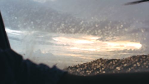 Scenic view of mountains seen through window
