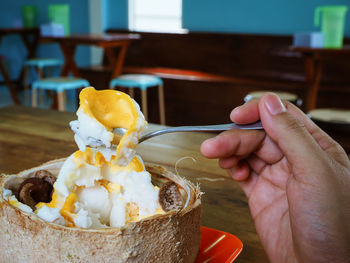 Midsection of person holding ice cream