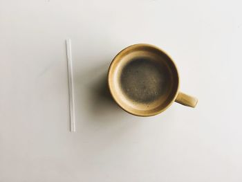 High angle view of coffee on table against white background