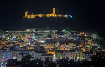 High angle view of illuminated buildings in city at night